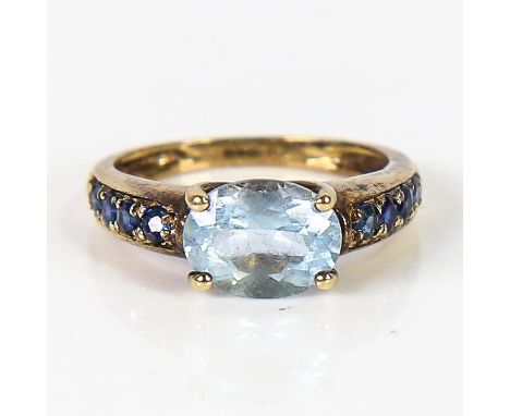 A modern 9ct gold blue topaz and sapphire dress ring, setting height 6.1mm, size K, 2.9gNo damage or repairs, all stones pres