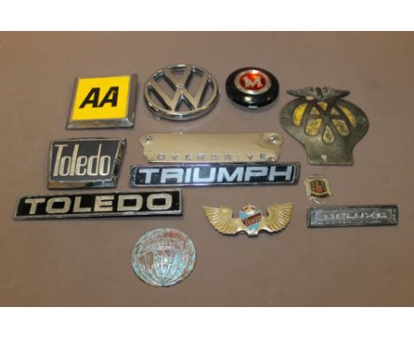A COLLECTION OF VINTAGE CAR BADGES