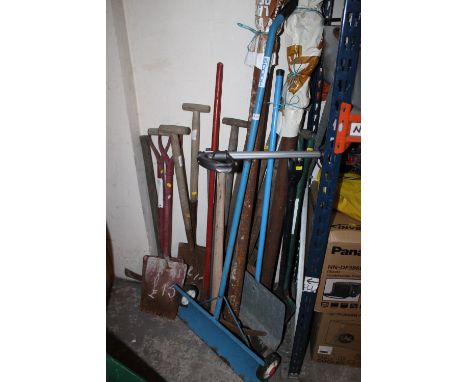 A SELECTION OF HAND TOOLS TO INC SPADES, PICKAXES, SNOW SHOVELS, PROPS ETC