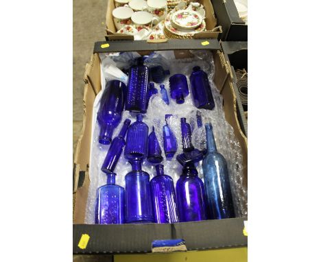 A COLLECTION OF APPROX 22 VINTAGE BLUE GLASS BOTTLES TO INC HOBNAIL EXAMPLES