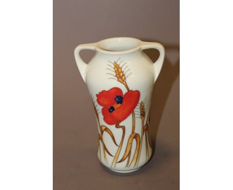 A TWIN HANDLED MOORCROFT HARVEST POPPY VASE