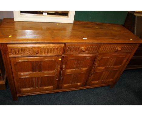 A PRIORY STYLE LIGHT OAK SIDEBOARD