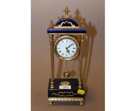 A BLUE AND GILT PORTICO MANTLE CLOCK