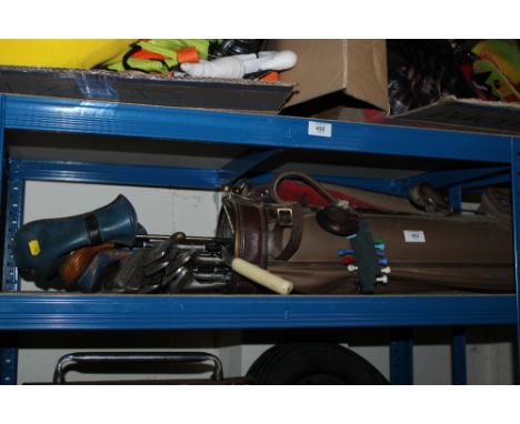 A SELECTION OF GOLF CLUBS ALONG WITH CADDY BAG