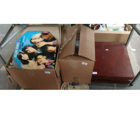 Three boxes of books and LPs and a record player. 