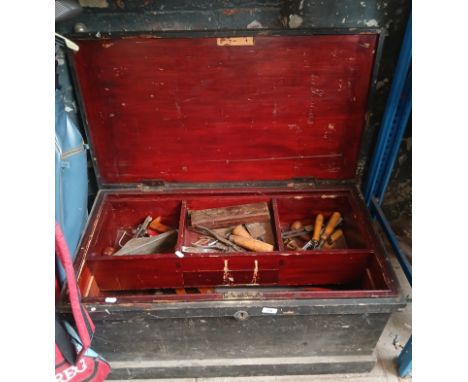 A large joiners toolbox with assorted tools. 