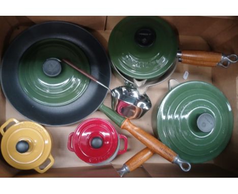 A box of mainly Le Cruset cooking pans. 