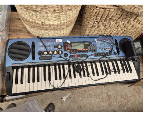 A Yamaha DJX keyboard with power lead 