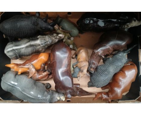 A box of assortedx rhino ornaments including Melba Ware, carved wood etc.