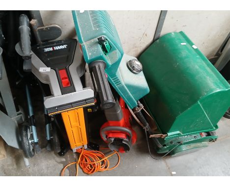 A Jawhorse together with a Worx WG 307 Electric Chainsaw and a Flymo Garden Vac, a Qualcast Petrol lawnmower, 14" Cut with gr