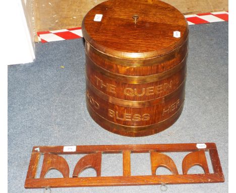 A coopered barrel with lid, The Queen God Bless Her, 33.5 cm high, and a folding whip rack (2)