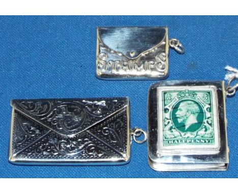 A silver and enamel stamp case, and two others similar (3)