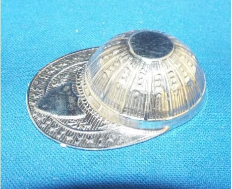 A silver caddy spoon, in the form of a jockey cap