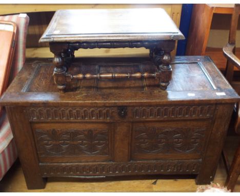 A carved oak coffer, 104 cm wide, and an oak low stool, 56 cm wide (2)