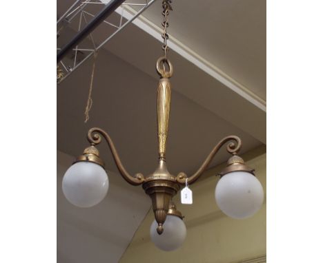 A gilt metal three branch electrolier, with opaque glass globe shades, and other light fittings