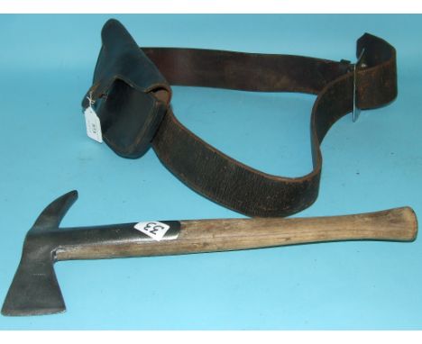 A 1930s Merryweather fireman's axe, with pouch and belt
