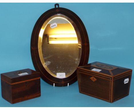 An inlaid mahogany tea caddy, 18.5 cm wide, another similar, and an inlaid mirror (3)