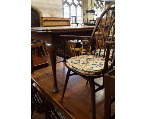 A set of five Ercol dining chairs, an oak dining table, an oak bookcase, a TV cabinet, and a walnut cupboard (9)