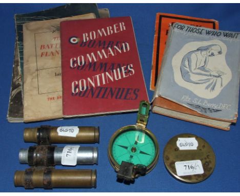 An early 20th century brass compass, inscribed A C Ward RE, three 20 mm cartridge cases, and a small group of books (box)