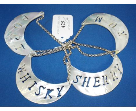 Four mother of pearl type decanter labels