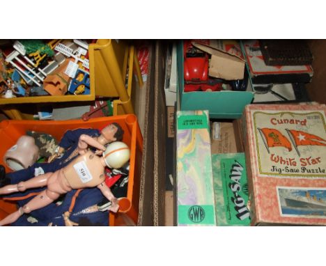 A Schuco Studio clockwork racing car, other similar clockwork cars, Action Man figures and accessories, jigsaw puzzles, board