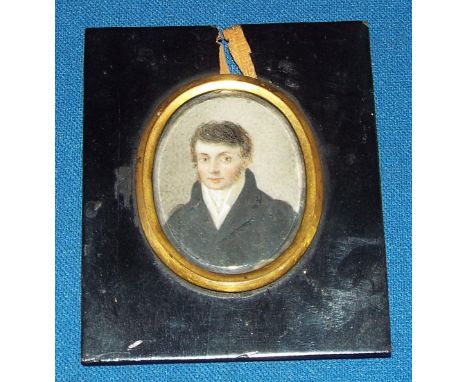 An oval bust portrait miniature, of a gentleman, watercolour, 4 x 3 cm