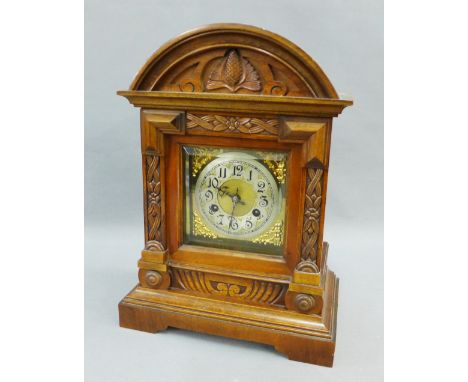 Walnut cased mantle clock with a silver dial and Arabic numerals, 40cm high 