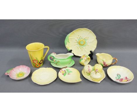 Carltonware fruit and flower pottery to include a yellow glazed mug, cruet set, napkin ring, cream jugs and dishes, etc (9) 