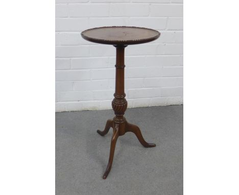 Mahogany pedestal wine table with circular top and beaded edge, on a ring turned column and spayed tripod legs, 