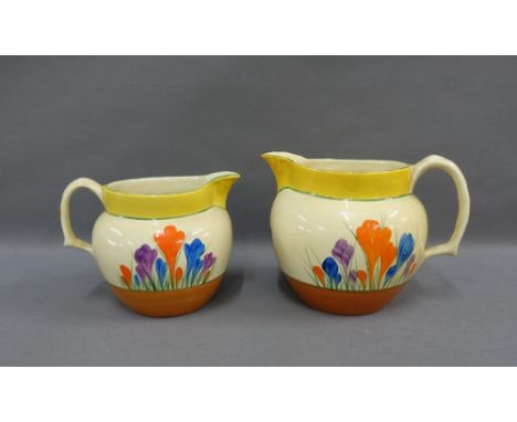 Clarice Cliff, Bizarre, Crocus patterned jugs, tallest 15cm (2) 