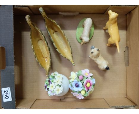 A collection of items to include Wade items, Beswick Labrador, Cairn Terrier and ceramic flowers (7) 