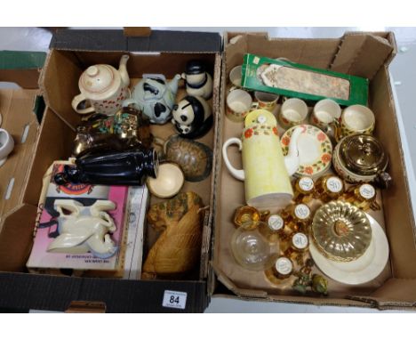A collection of Wade teaware, advertising figures, teapots, Wade collectors books etc (2 trays)