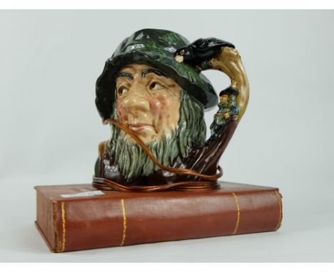 Royal Doulton unusual large character jug Rip Van Winkle mounted as a lamp on a sketch book
