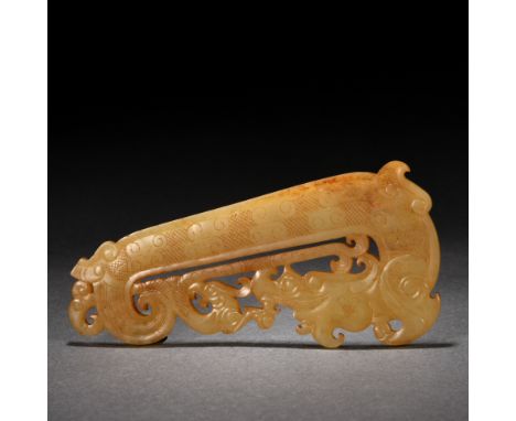 A Chinese Carved Jade OrnamentDimensions: Length 4 1/8 inches, Width 1 7/8 inches (10.7 cm x 5 cm). Han Dynasty.