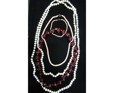 Natural pearl necklace with 14ct gold clasp stamped 14K L145cm, a necklace with faceted ruby beads, and another beaded neckla