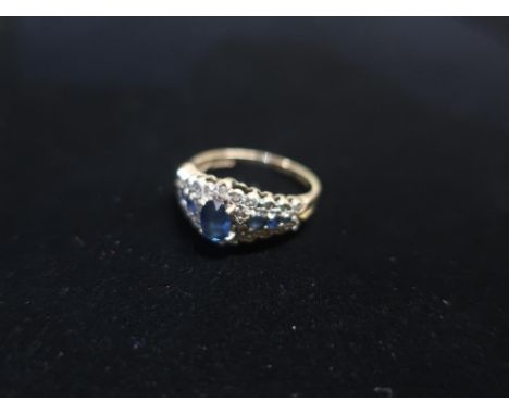 9ct gold Diamond and blue sapphire ring stamped 375 Size M, 2.6g 