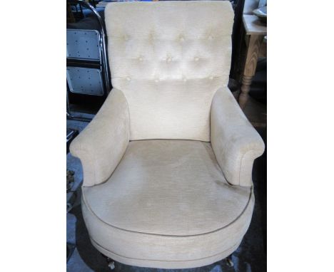 Victorian style club chair, with button back, out scrolled arms and bow seat upholstered in old gold cord, on turned supports