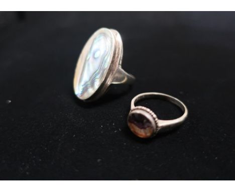 Aberlone Mother of Pearl ring with silver mount stamped 925 Size M and another ring with amethyst center Size  O 1/2 