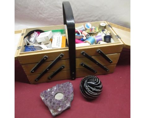 Wooden cantilever sewing box with contents, an amethyst tea light holder, Parlane large glass paperweight (3) 