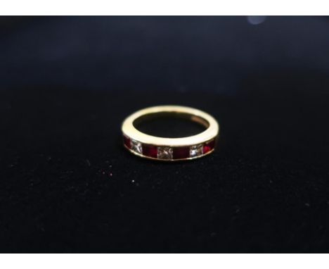 Hallmarked 18ct gold half hoop eternity ring set with princess cut diamond and ruby stamped 750, CG&amp;S (assay mark unknown