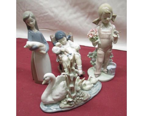 Lladro figure of a sleeping girl in a rocking chair holding a doll H11cm, Lladro figure of a young girl holding a bunch of fl