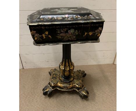 A Japaned Work or Sewing Box with mother of pearl detailing and fitted compartments.