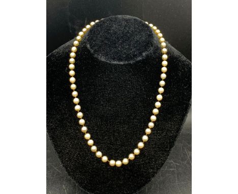 A Pearl necklace with a 9ct gold and semi precious stone clasp