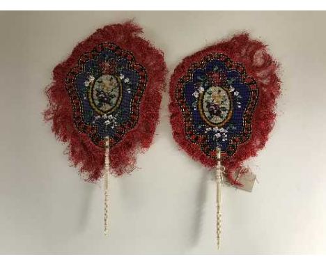 A pair of ivory handled beaded hand fans 