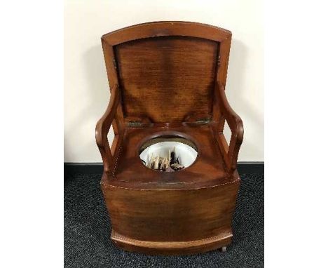 A Victorian mahogany commode chair 