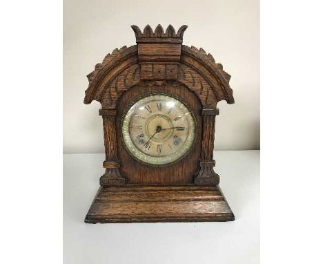 An oak late nineteenth century American mantle clock by Ansonia Clock company New York