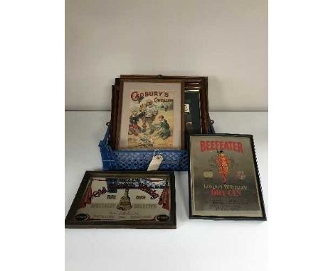 A box of seven framed pictures including Cadbury's and Jacobs advertising, three watercolours depicting rabbits and Bells Sco