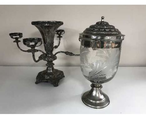 A plated epergne and a plated and glass lidded candle holder 