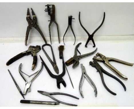 A collection of watchmaker's pliers and other tools, two marked L. Hugoniot-Tissot