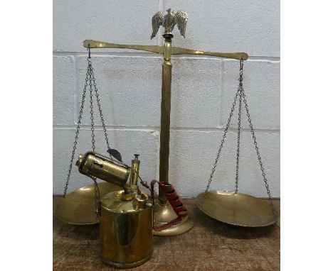 A set of brass scales and a brass monitor blow lamp